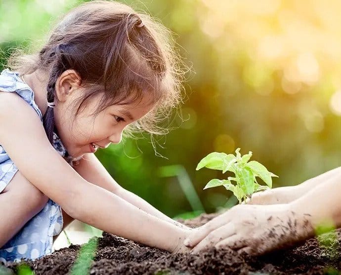 Girl Planting — Early Learning in Highfields, QLD