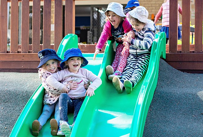 Kids Playing On Slide — Early Learning in Highfields, QLD