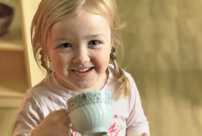 Kid Drinking In Teacup — Early Learning in Highfields, QLD