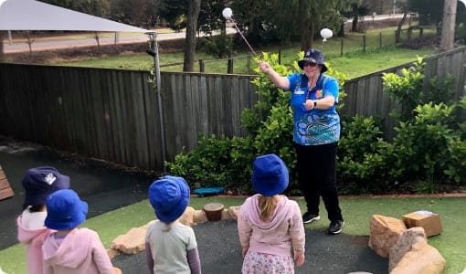 Woman Teaching Kids— Early Learning in Highfields, QLD