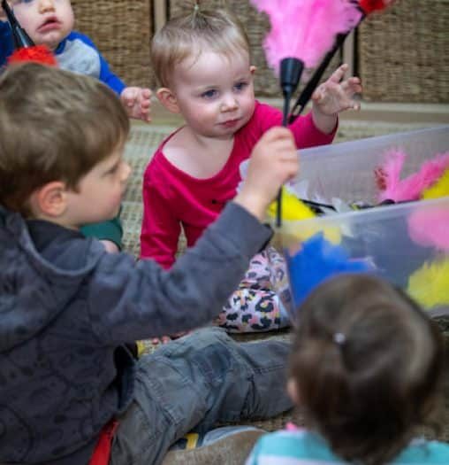 Kids Playing With Feathers — Early Learning in Highfields, QLD
